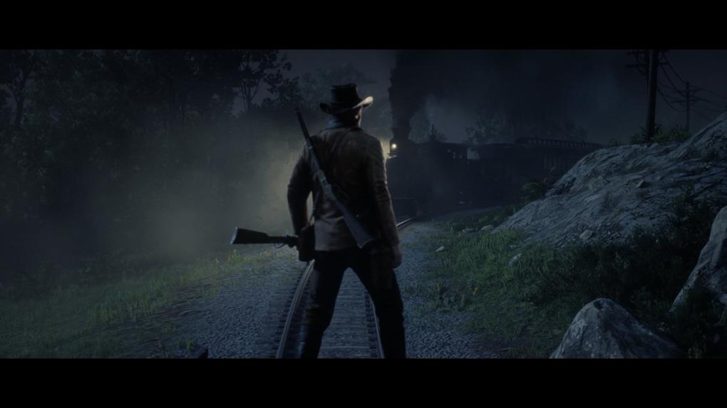 Arthur Morgan steht auf dem geklauten Wagen. Ein Zug nähert sich.