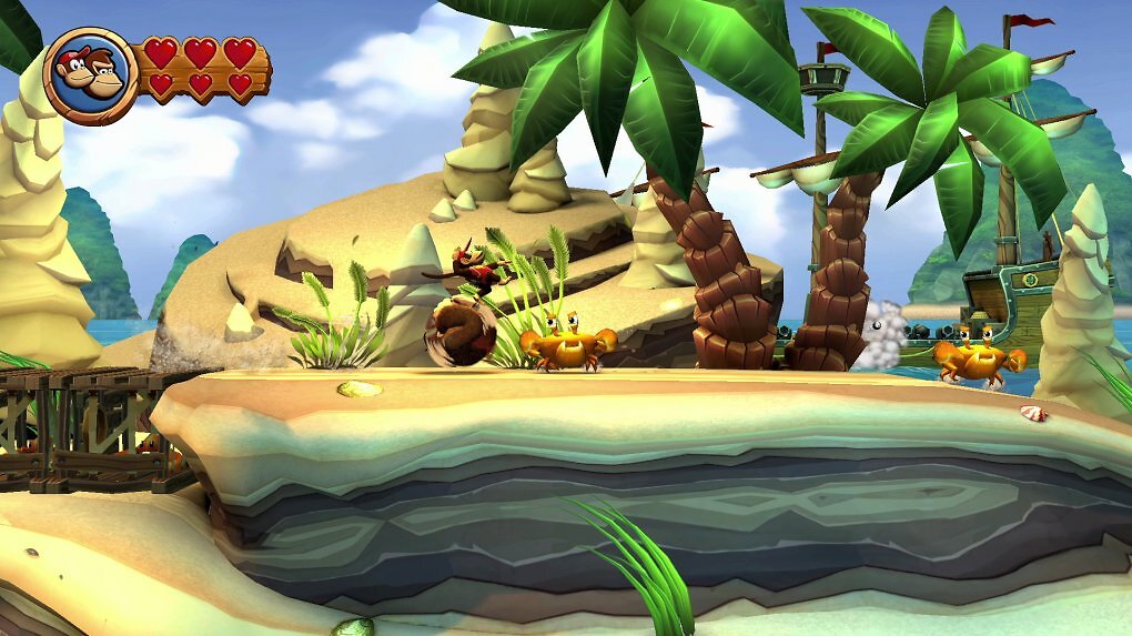 Donkey Kong führt eine Rolle aus, während Diddy auf ihm balanciert.