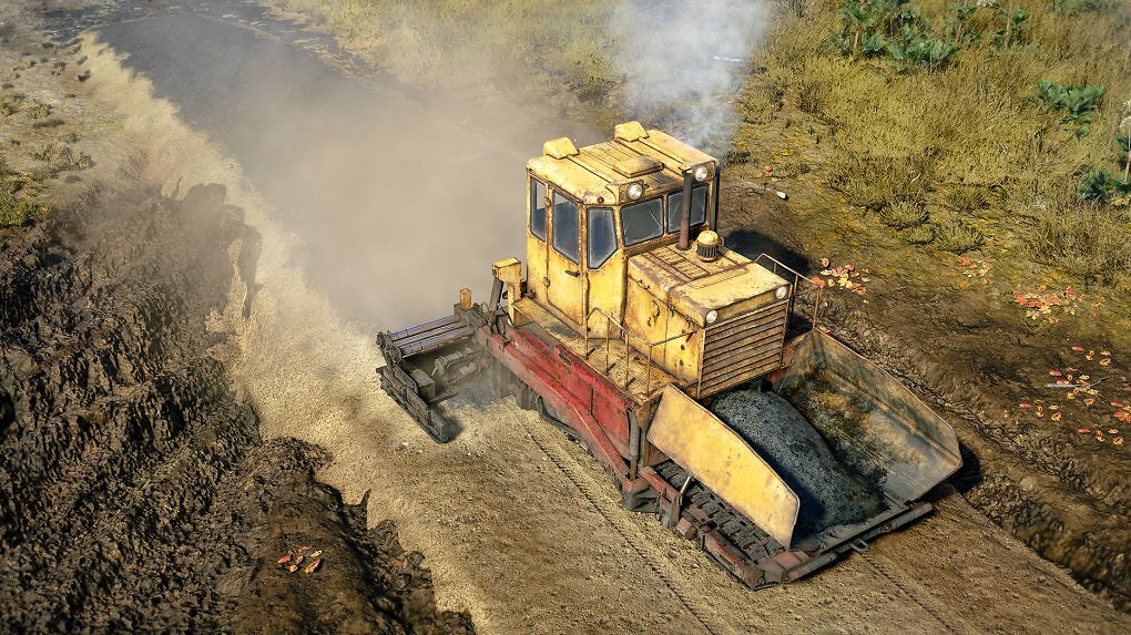 Eine Maschine legt Asphalt auf Sand