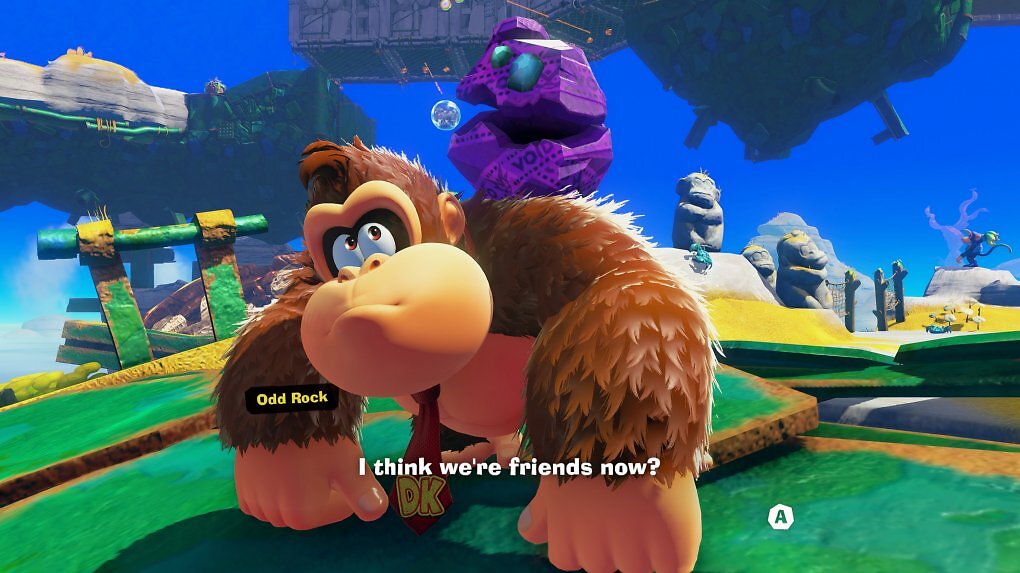 Donkey Kong schließt sich mit einem sprechenden Felsbrocken zusammen.