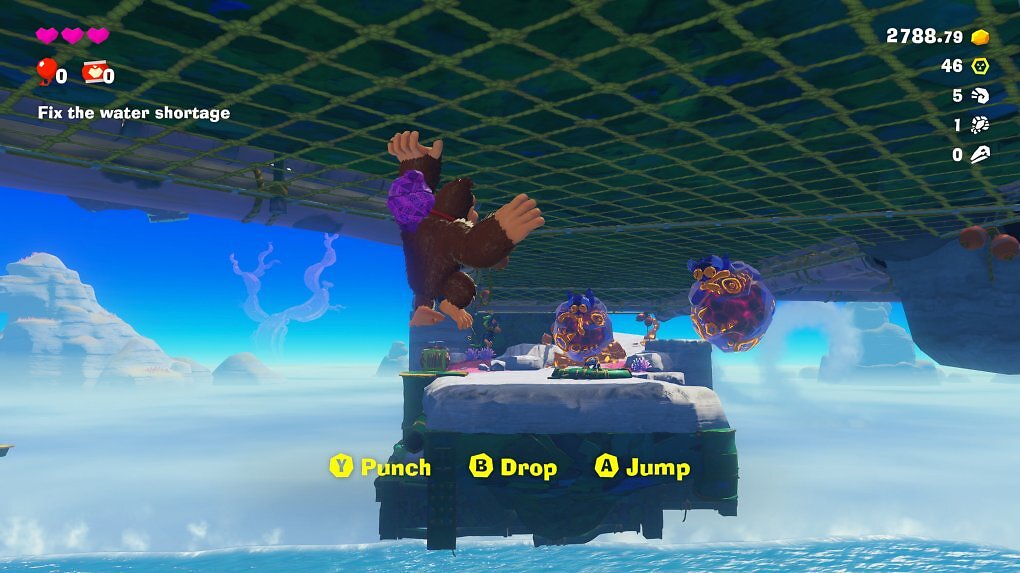 Donkey Kong klettert an einer Decke entlang.