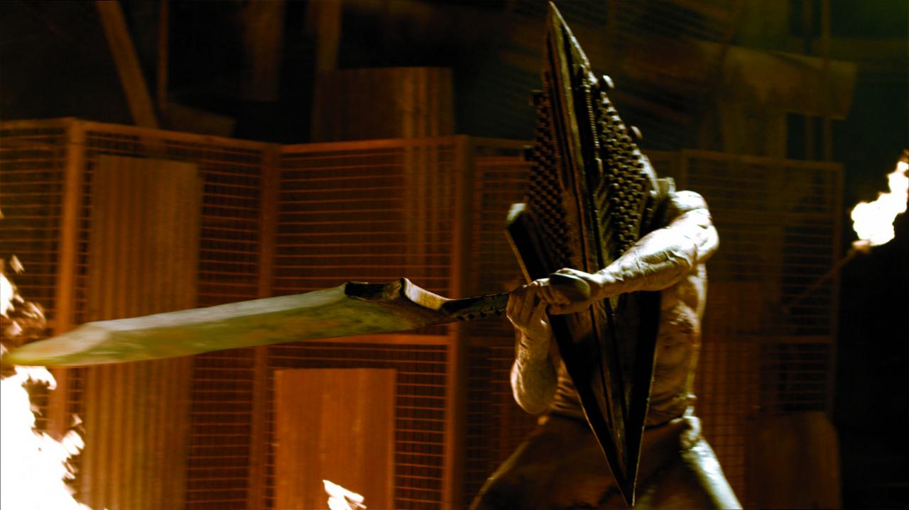 [12/11/2012] Vor dem Entwickler unserer nächsten Gestalt würden selbst Größen wie Stephen King eine tiefe Verbeugung einlegen. Pyramid Head aus der Silent Hill Reihe, liebevoll auch Pyri genannt, ist mehr als einfach nur verstörend. Wozu der pyramidenförmige Helm dient, wissen wir nicht genau. Vor seiner Klinge solltet ihr euch aber auf jeden Fall in Acht nehmen.