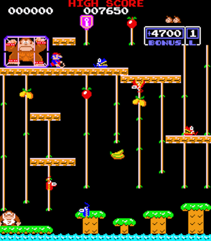 Donkey Kong Junior erschien 1982 und lief auf einer Z80-CPU mit 3.072 MHz. Held ist Donkey Kongs Sohn, der seinen Vater aus den Fängen von Mario befreien muss.