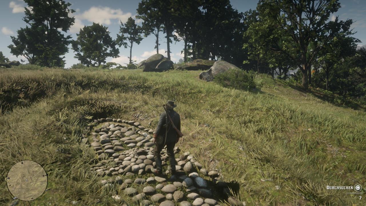 Arthur Morgan sucht im Loch am Schlangenkopf nach dem Schatz.