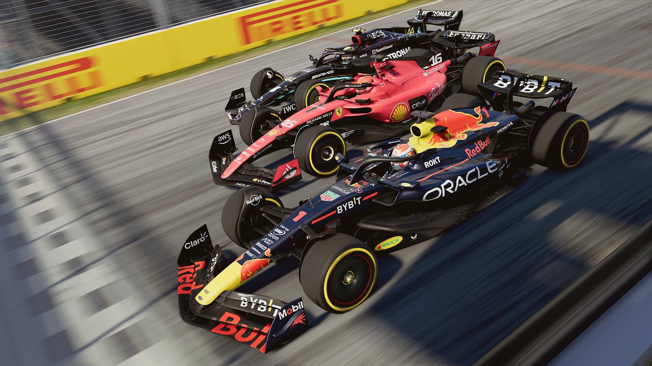 Auf dem Bild sind die drei großen Teams der F1 zu sehen, Red Bull Racing, Ferrari und Mercedes, die sich auf der Strecke messen.