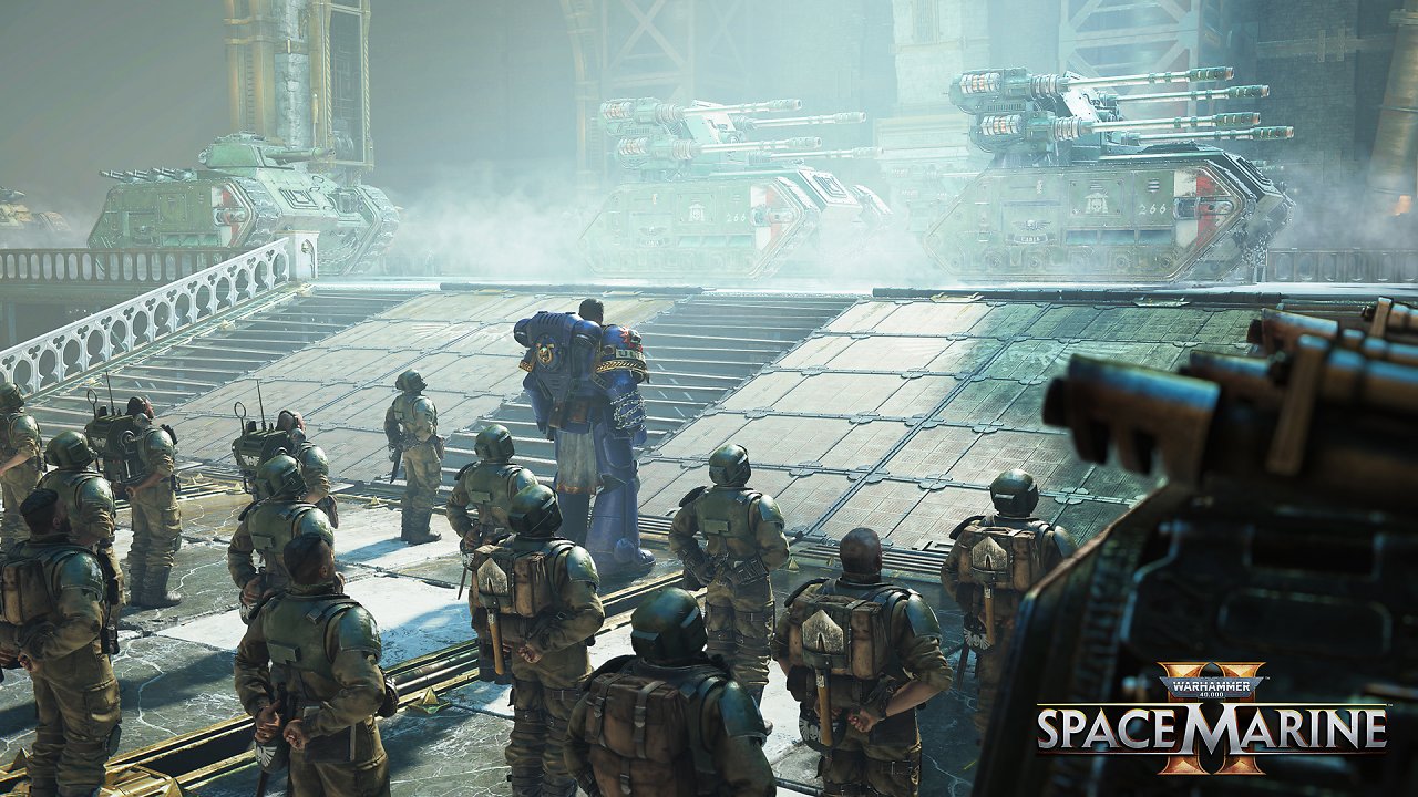 Ultramarines und Cadianer schauen sich Hydra-Panzer an.