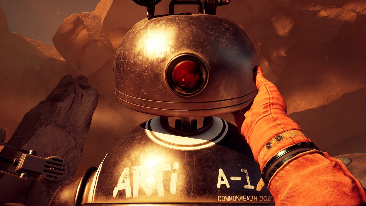 Die Protagonistin inspiziert den Kopf eines humanoid aussehenden Roboters.