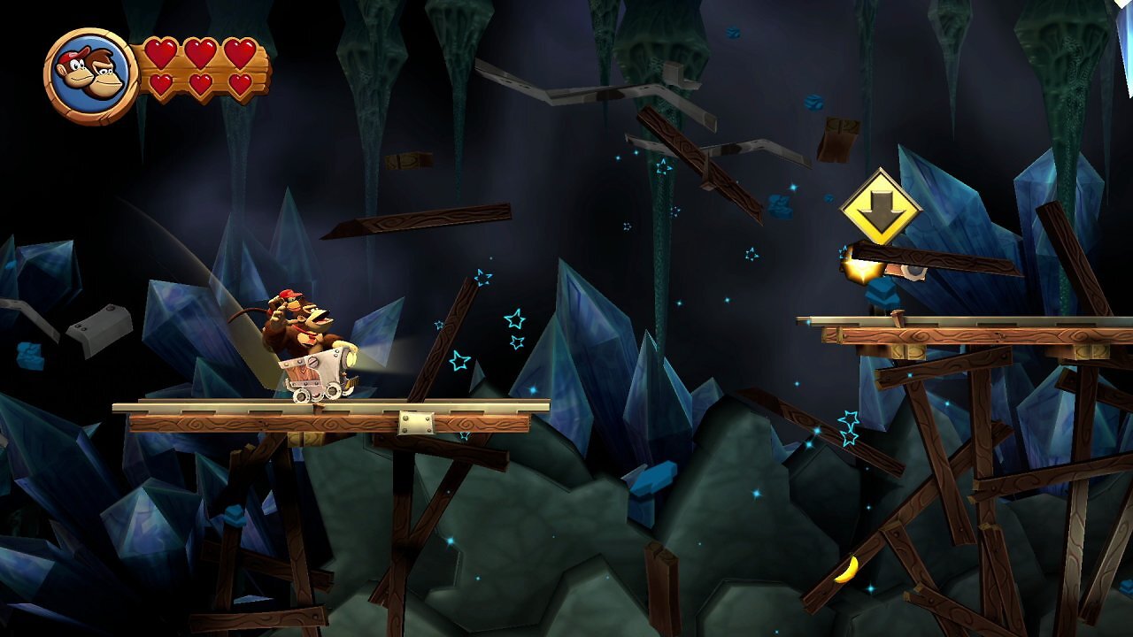 Donkey Kong und Diddy Kong fahren in einer Minenlore