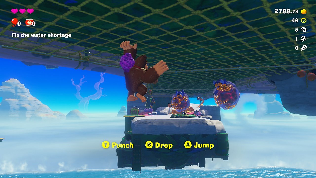 Donkey Kong klettert an einer Decke entlang.