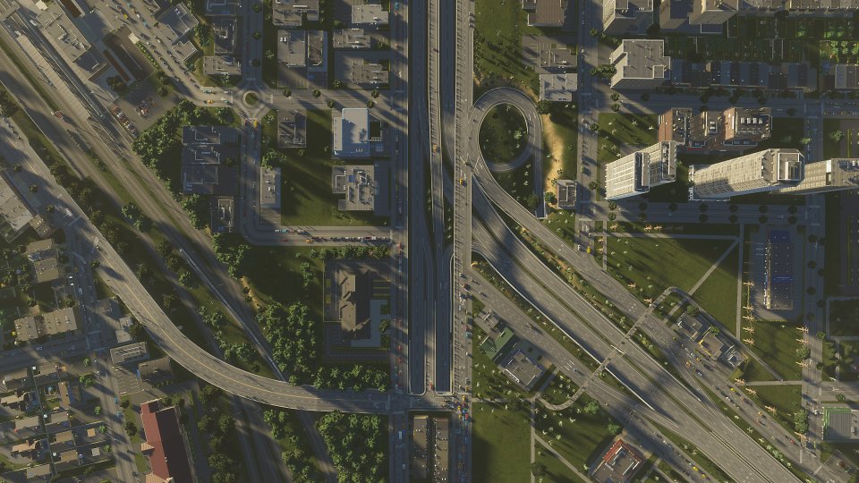 Draufsicht auf einen Stadtausschnitt mit einem Autobahn-Dreieick.